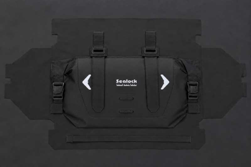 Flat bike bag panel with strap webbing and anchor patches stitched on before welding