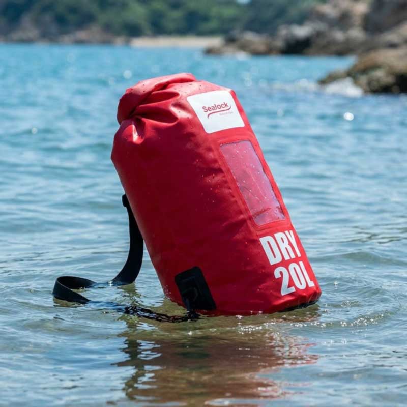 Sealed 20 litre roll-top dry bag floating high on the water surface